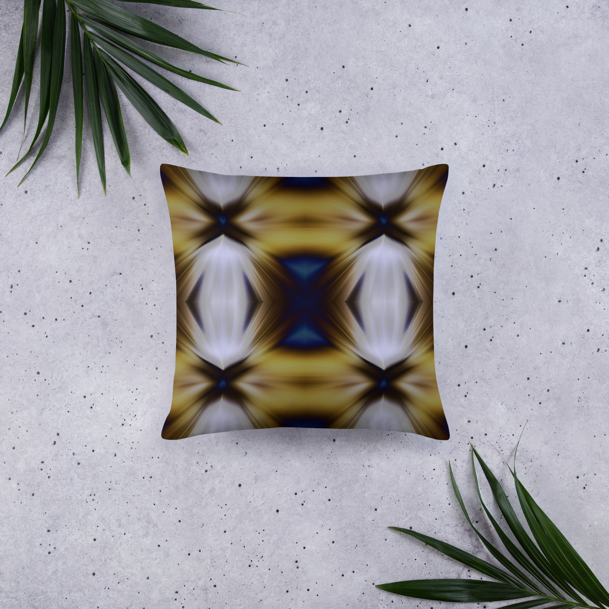 Square decorative cushion with kaleidoscope pattern featuring symmetrical geometric shapes in golden, brown, and cream colors creating optical effect