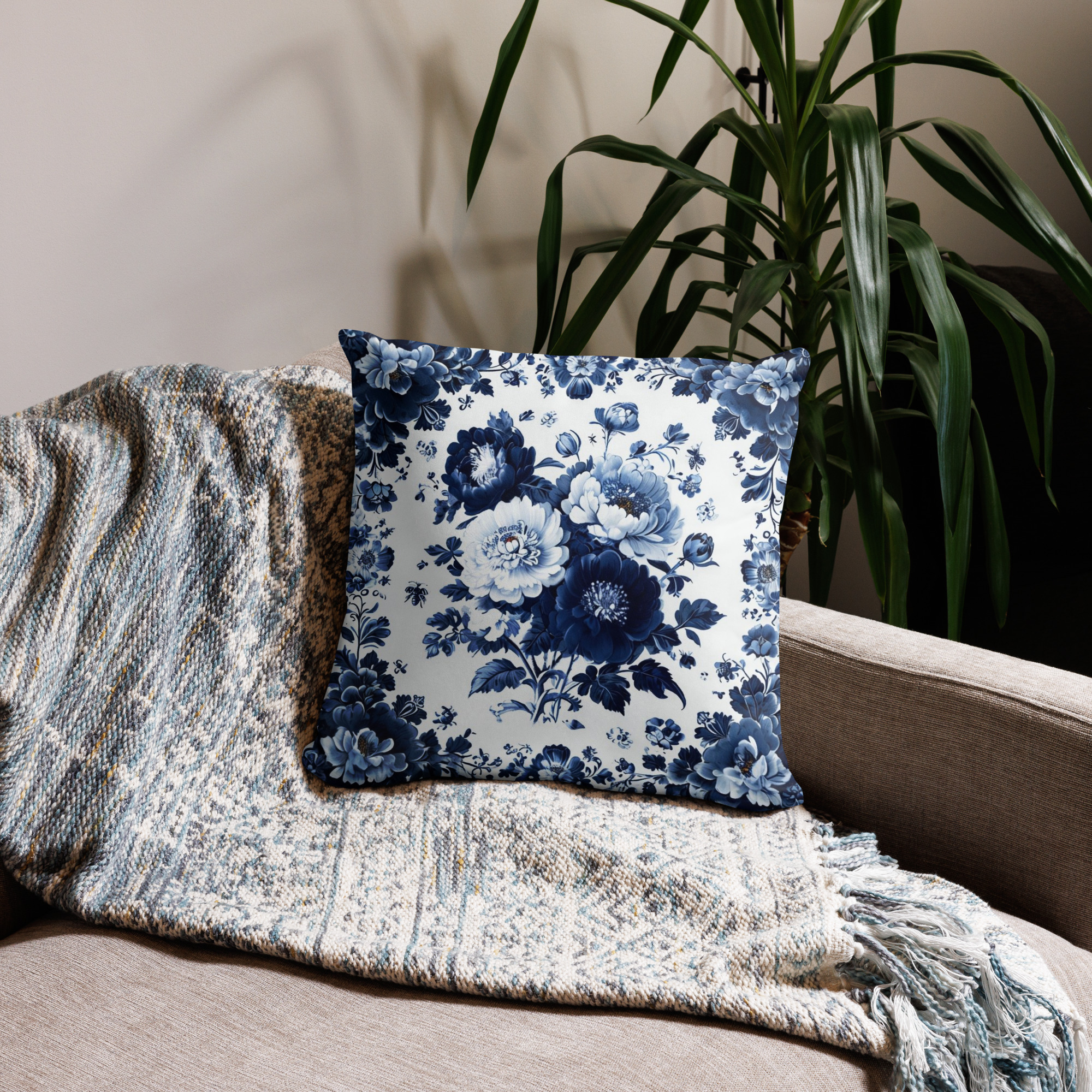 Navy blue decorative pillow with white vintage floral botanical pattern featuring roses and delicate motifs on rich navy background