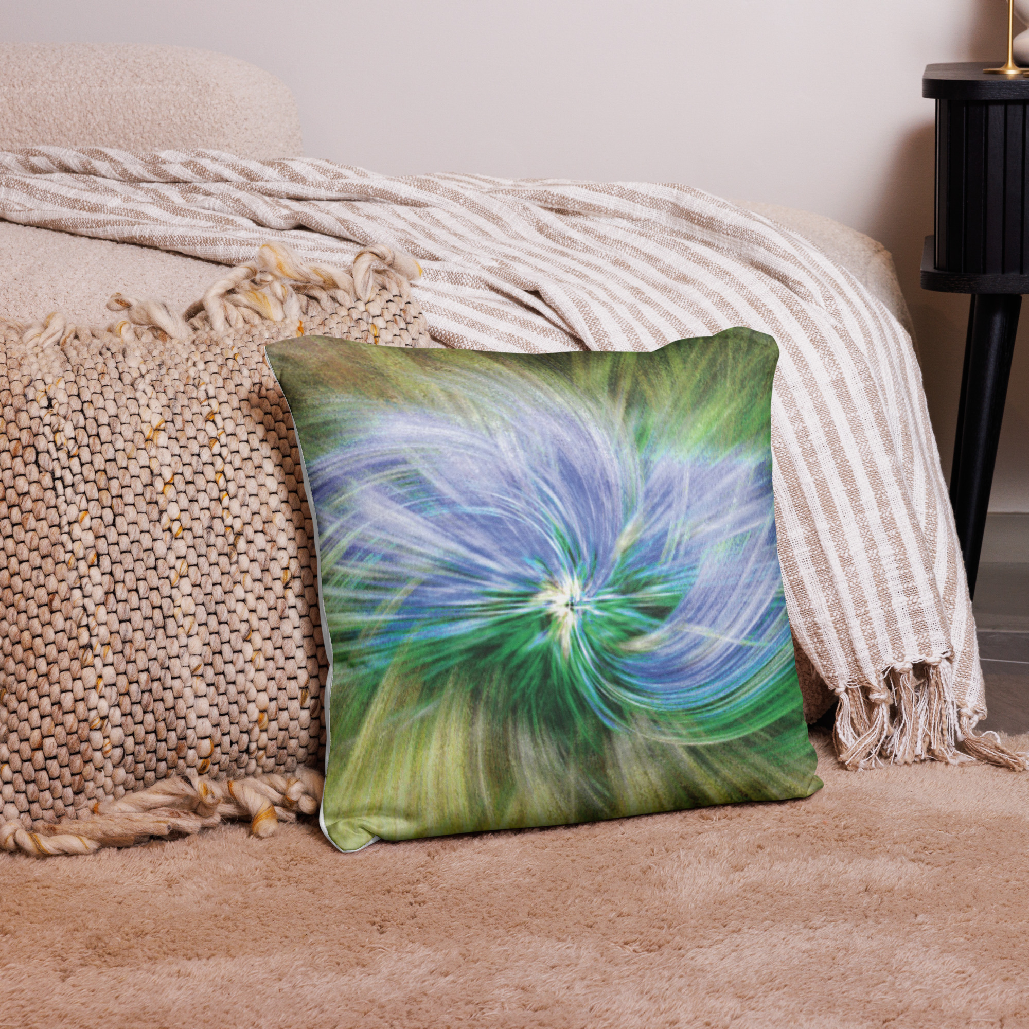 decorative cushion with abstract swirl pattern featuring flowing circular motions in soft blue, green, and cream colors creating serene chaos design