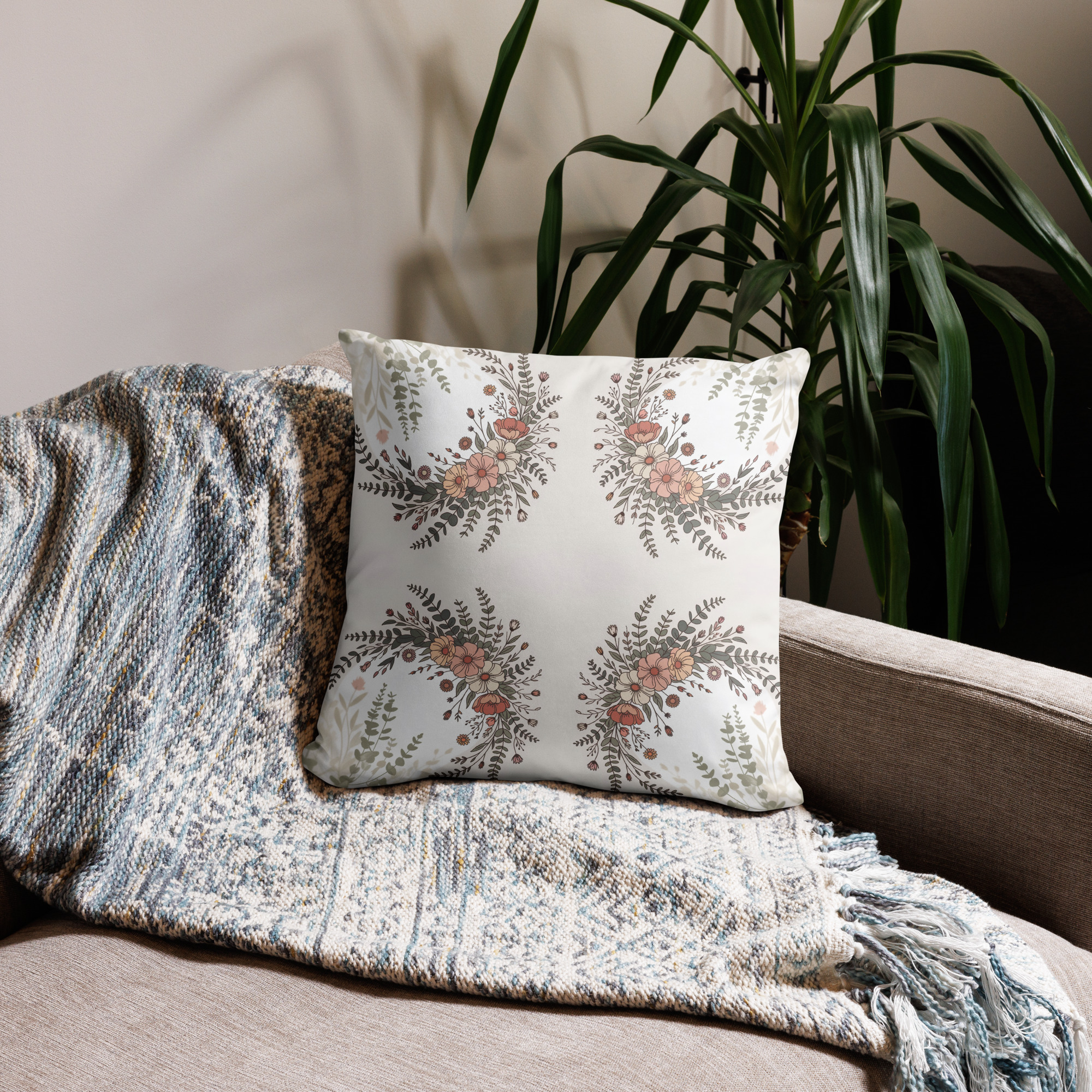 Square decorative cushion with bohemian wildflower pattern featuring symmetrical floral motifs in terracotta, cream and beige tones