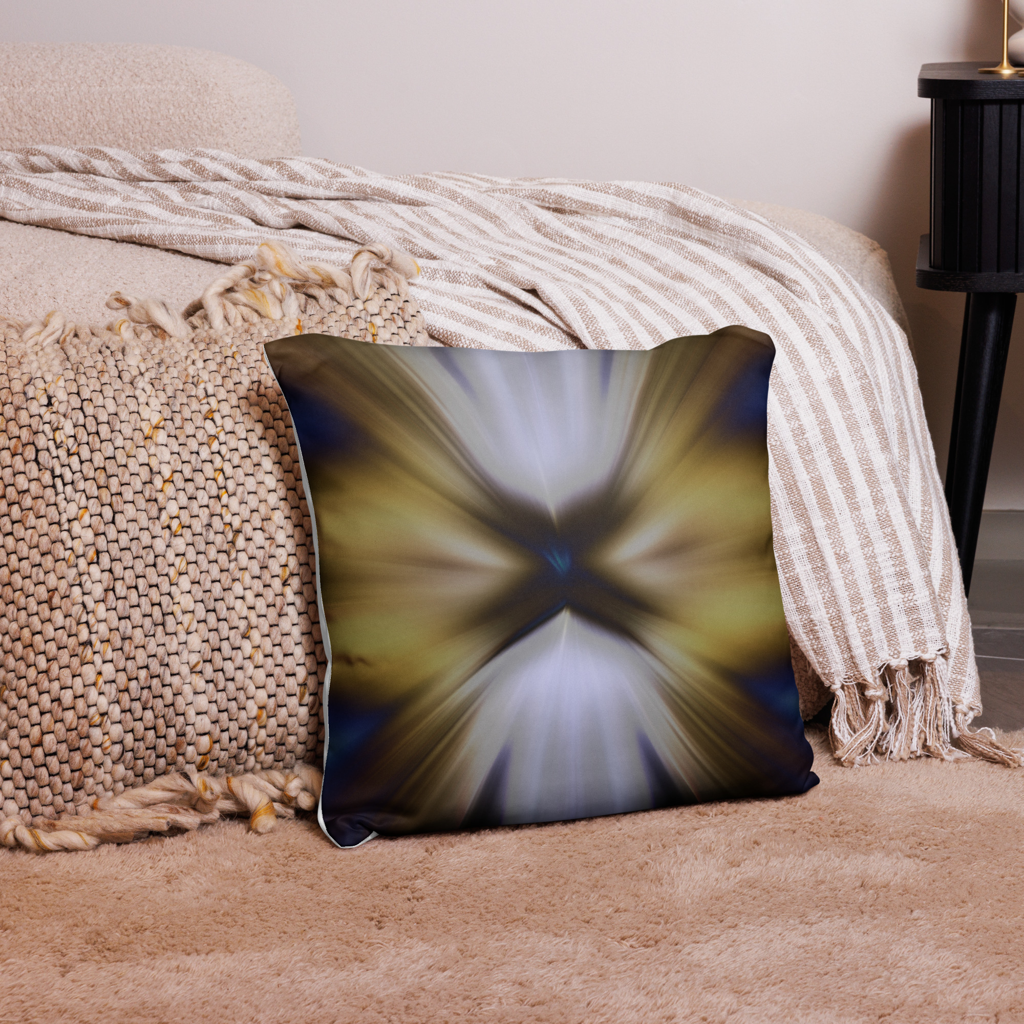 Square decorative cushion with radial burst pattern featuring golden brown and cream rays exploding from center creating dramatic light effect