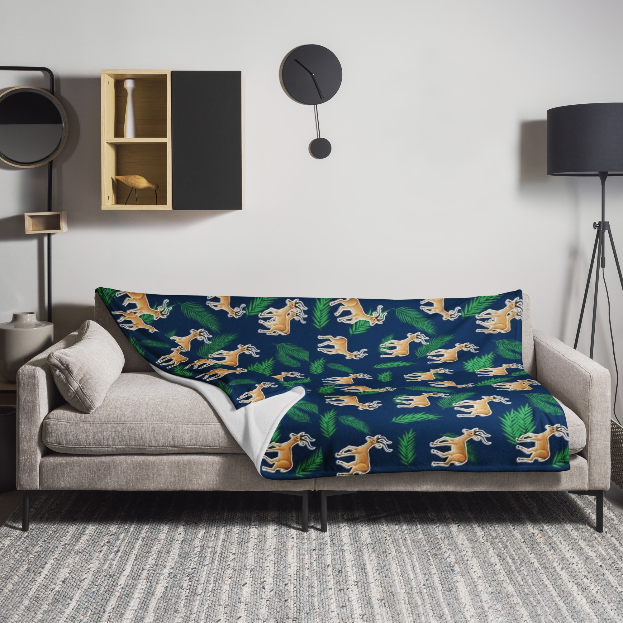 Safari wildlife blanket with elegant gazelles and tropical leaves design in natural green tones