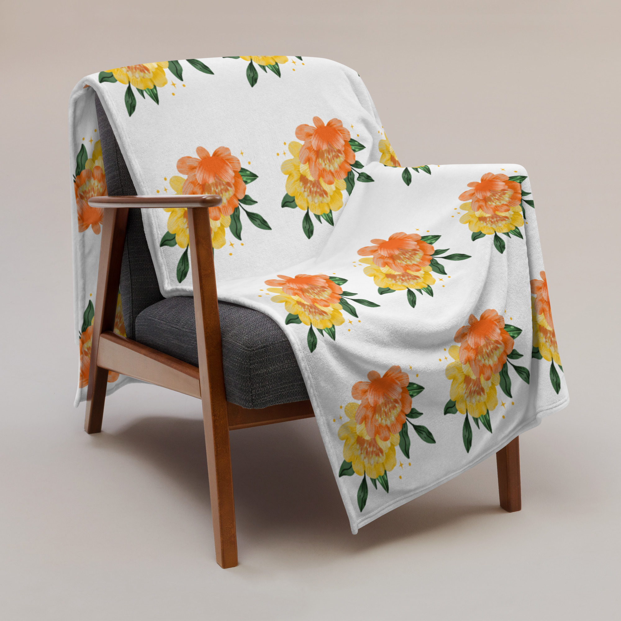 Pattern blanket with repeating orange flower design on white background